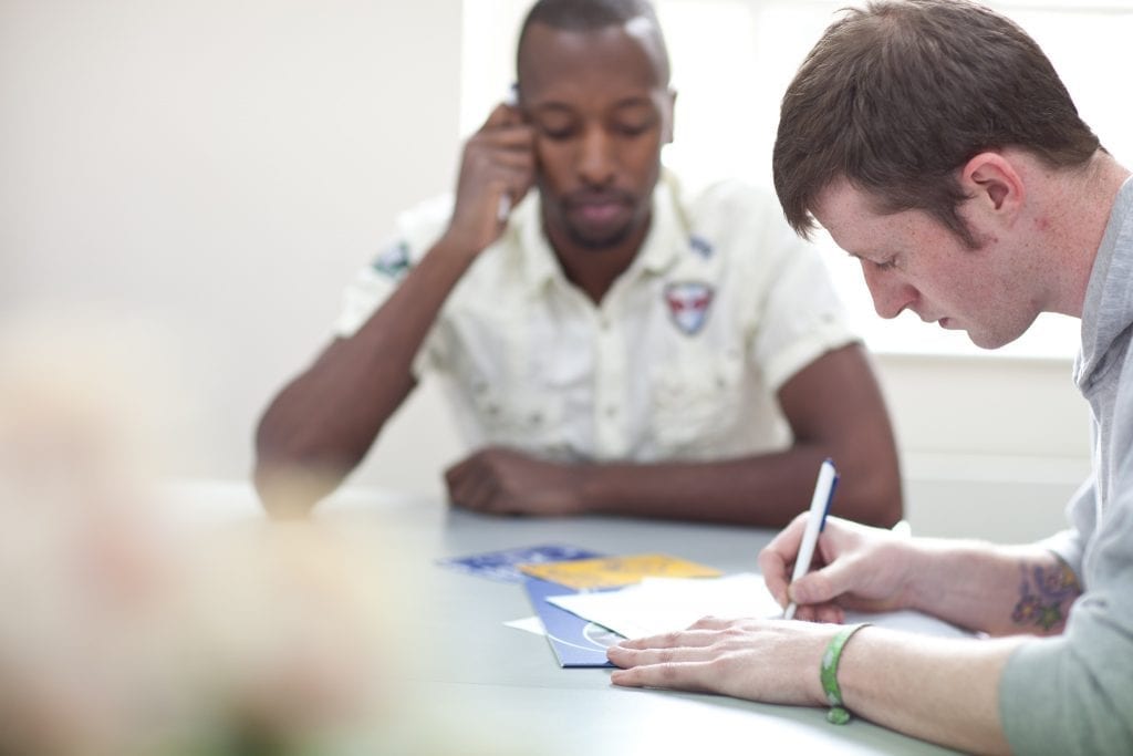 people completing a form