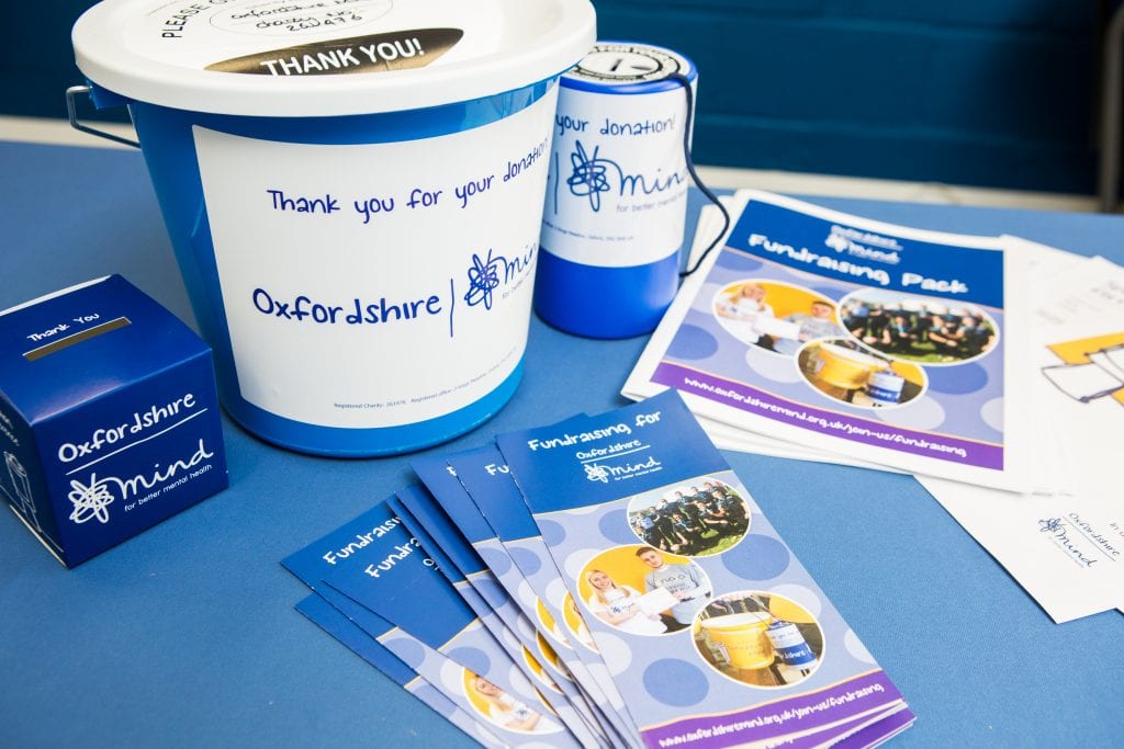 A photo of a range of fundraising resources including a collection bucket and information leaflets