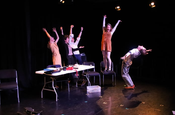 Photo of actors looking stressed on a stage